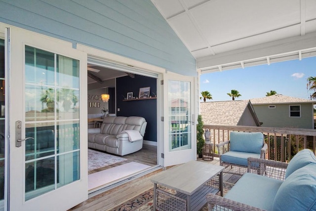 balcony featuring a sunroom and an outdoor hangout area