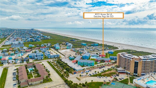 aerial view featuring a water view and a beach view