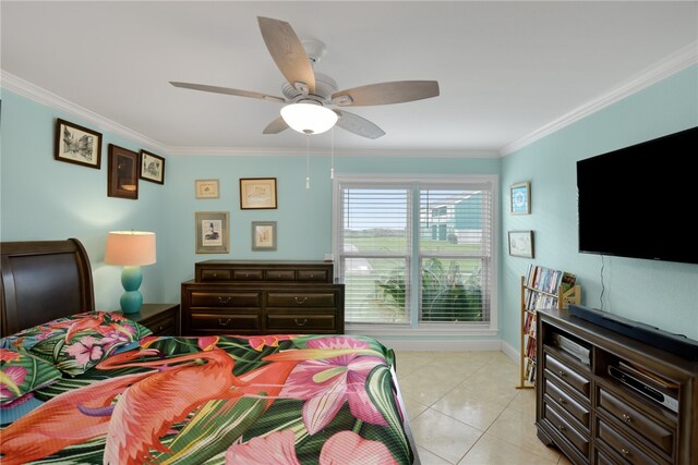 bedroom featuring light tile patterned floors, baseboards, a ceiling fan, and crown molding