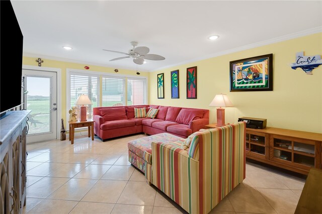 living room with light tile patterned flooring, a ceiling fan, and crown molding