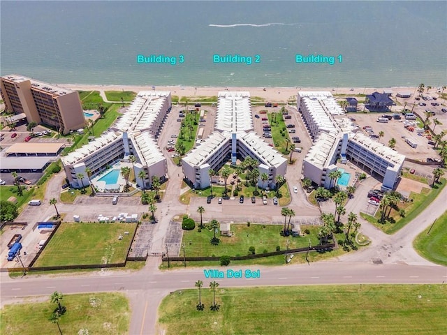 3938 Surfside Blvd Unit 1337, Corpus Christi, TX 78402 - aerial view of a large body of water and a pool area