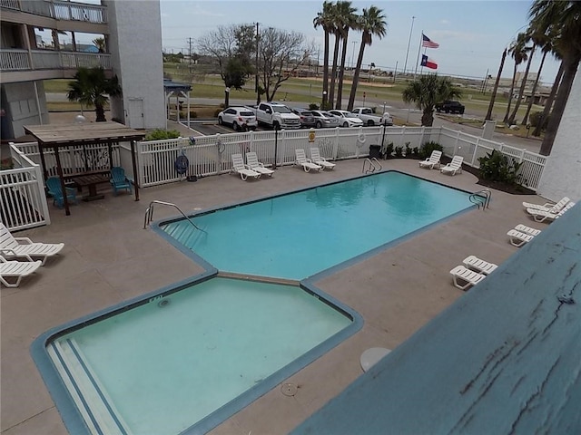 view of pool featuring a patio area