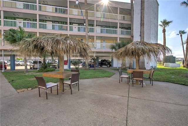 3938 Surfside Blvd Unit 1337, Corpus Christi, TX 78402 - view of community with outdoor dining space, a patio area, and a lawn
