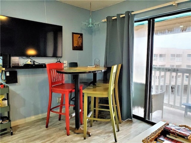 dining area with light hardwood / wood-style flooring