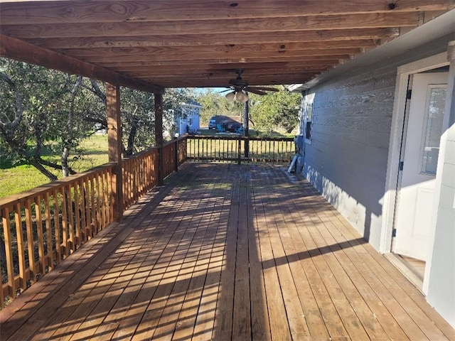 wooden deck featuring ceiling fan