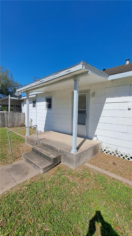 exterior space with a front yard and fence