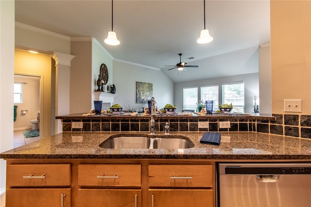 kitchen featuring sink, vaulted ceiling, dark stone countertops, stainless steel dishwasher, and ceiling fan