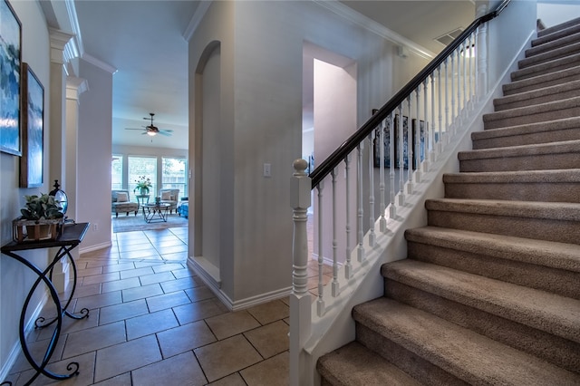 entryway with light tile patterned flooring, crown molding, and ceiling fan