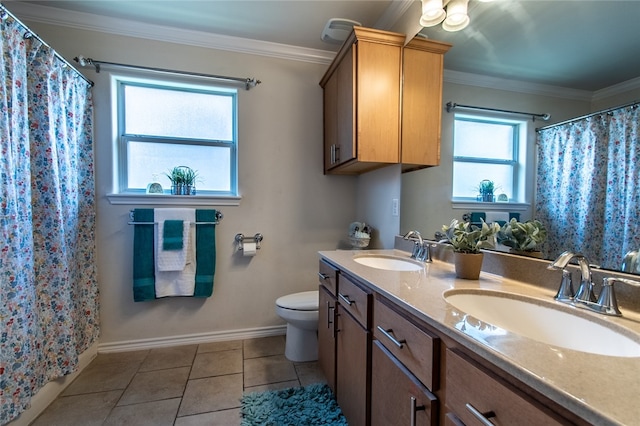 bathroom with toilet, tile patterned flooring, a healthy amount of sunlight, and crown molding