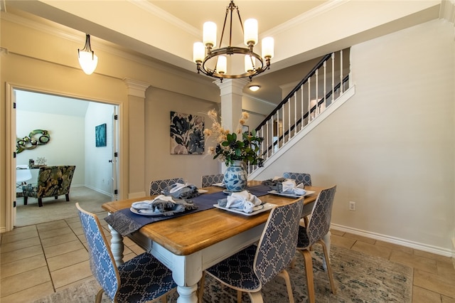 dining area with decorative columns and crown molding