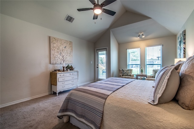 bedroom with ceiling fan, carpet flooring, and vaulted ceiling