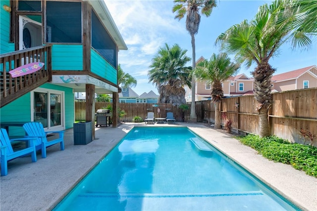 616 Sandcastle Dr, Port Aransas, TX 78373 - view of swimming pool with a patio area, a fenced backyard, and a grill