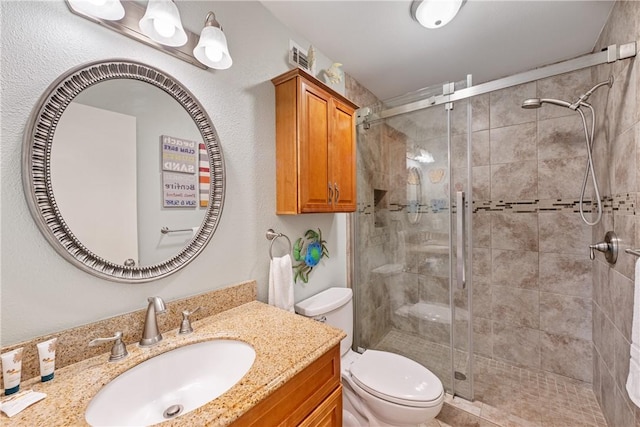 616 Sandcastle Dr, Port Aransas, TX 78373 - full bath with a stall shower, toilet, and vanity