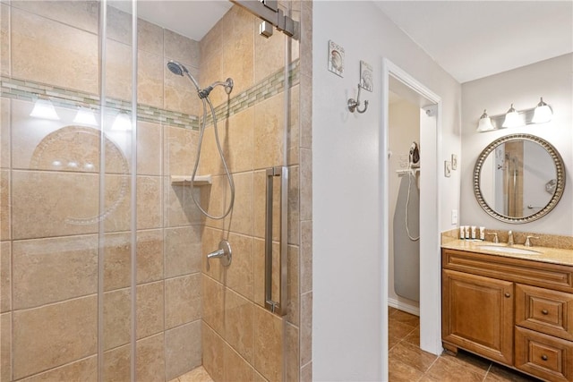 616 Sandcastle Dr, Port Aransas, TX 78373 - bathroom with a stall shower, tile patterned floors, and vanity