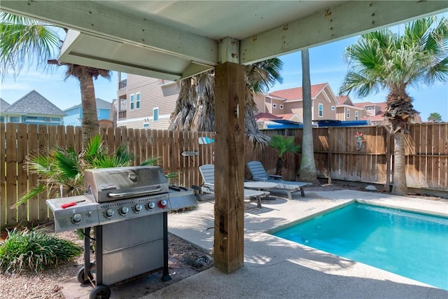 616 Sandcastle Dr, Port Aransas, TX 78373 - view of pool with a patio, area for grilling, a fenced backyard, and a residential view