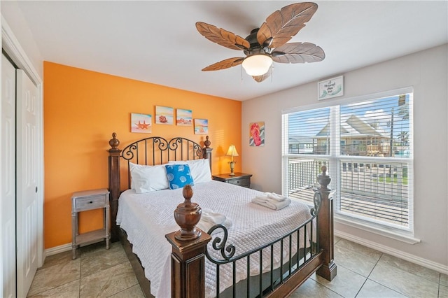 616 Sandcastle Dr, Port Aransas, TX 78373 - bedroom with a closet, tile patterned floors, baseboards, and ceiling fan