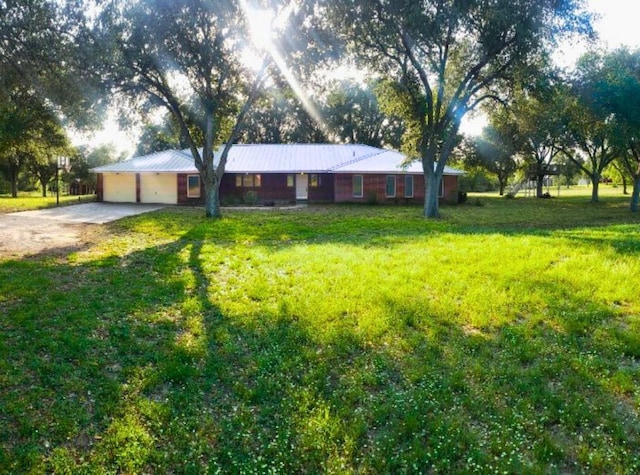 112 Fm 1042, Three Rivers, TX 78071 - single story home featuring driveway, a front lawn, and a metal roof