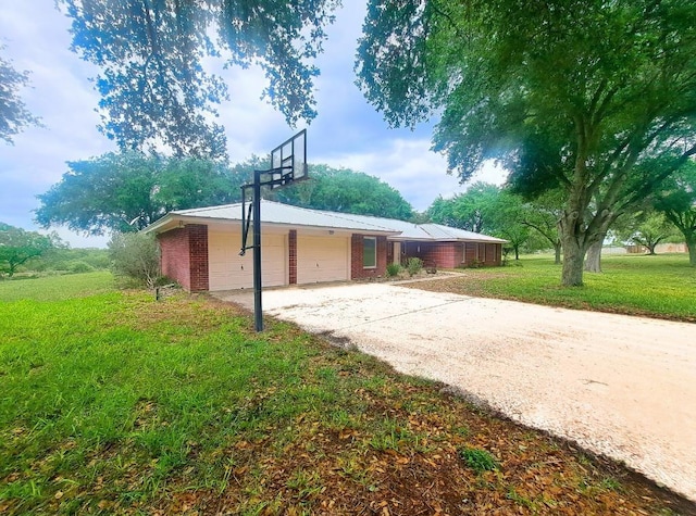 112 Fm 1042, Three Rivers, TX 78071 - view of property exterior with brick siding, a lawn, and concrete driveway