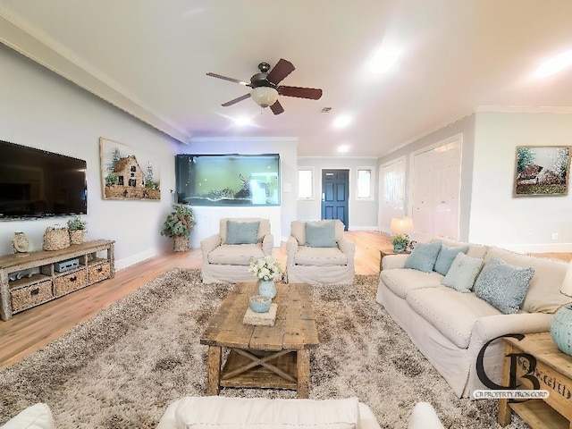 112 Fm 1042, Three Rivers, TX 78071 - living room featuring crown molding, wood finished floors, and a ceiling fan