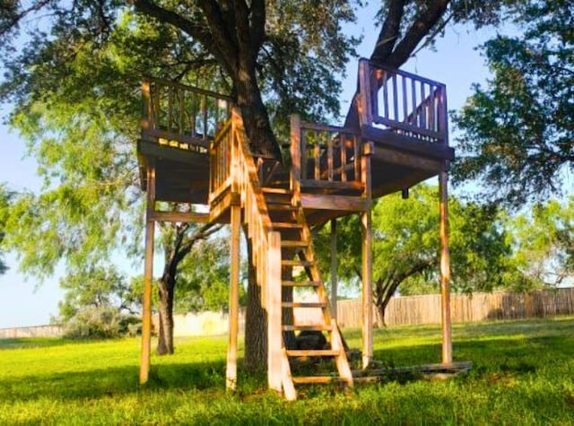112 Fm 1042, Three Rivers, TX 78071 - view of jungle gym with stairway and a deck