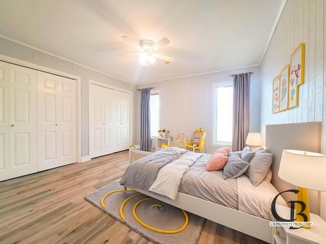 112 Fm 1042, Three Rivers, TX 78071 - bedroom featuring ornamental molding, multiple closets, wood finished floors, and ceiling fan