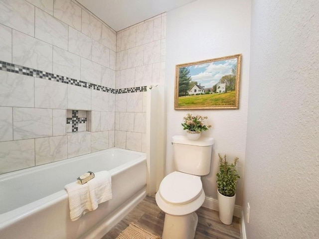 112 Fm 1042, Three Rivers, TX 78071 - full bath featuring wood finished floors, bathtub / shower combination, and a textured wall