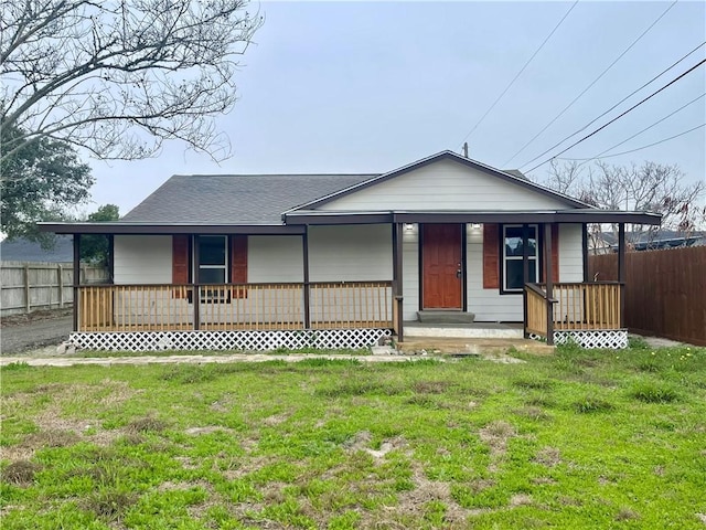 view of front of home with a porch and a front lawn