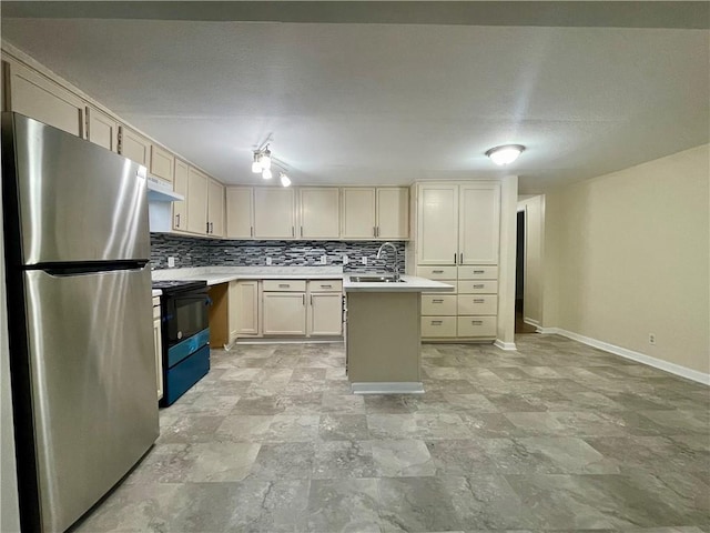 kitchen with sink, stainless steel fridge, black range with electric stovetop, a center island, and tasteful backsplash