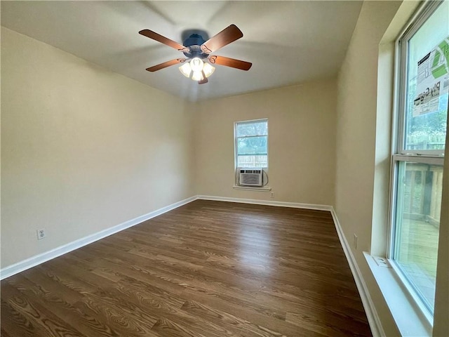 unfurnished room featuring dark wood-type flooring, ceiling fan, and cooling unit