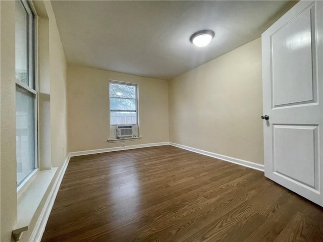 spare room with dark wood-type flooring and cooling unit