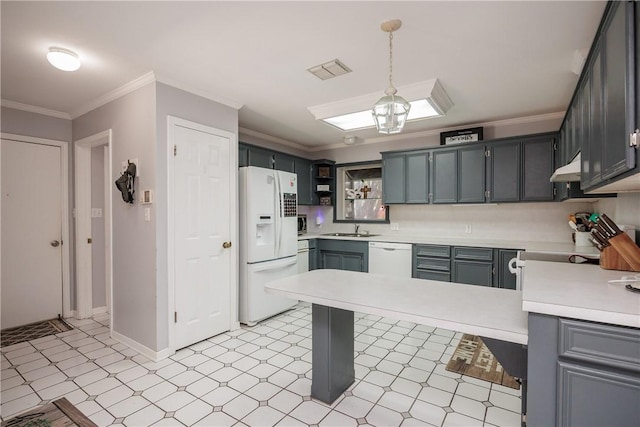 537 Vista Dr, Odem, TX 78370 - kitchen with white appliances, a peninsula, light countertops, under cabinet range hood, and ornamental molding