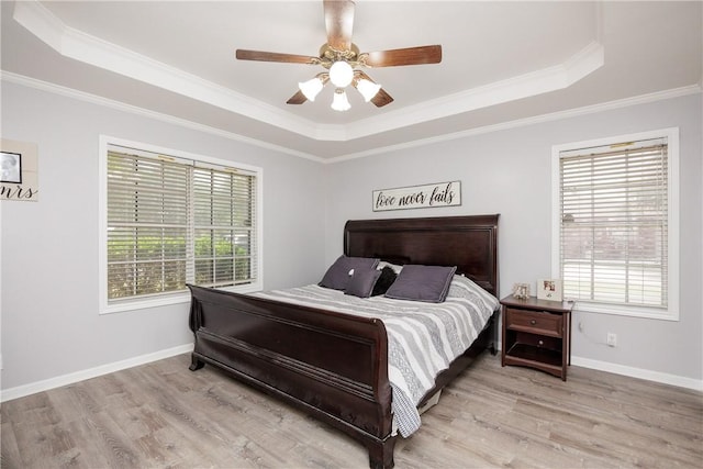 537 Vista Dr, Odem, TX 78370 - bedroom featuring a raised ceiling, multiple windows, and ornamental molding