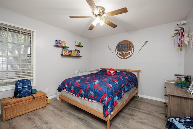 537 Vista Dr, Odem, TX 78370 - bedroom with wood finished floors, baseboards, and ceiling fan