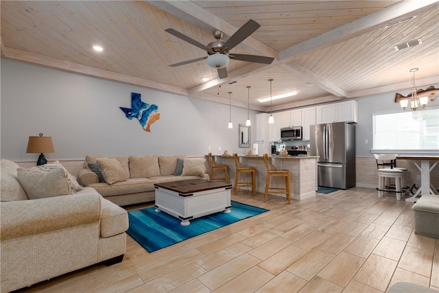 living room with beamed ceiling, ceiling fan with notable chandelier, light hardwood / wood-style flooring, and wooden ceiling