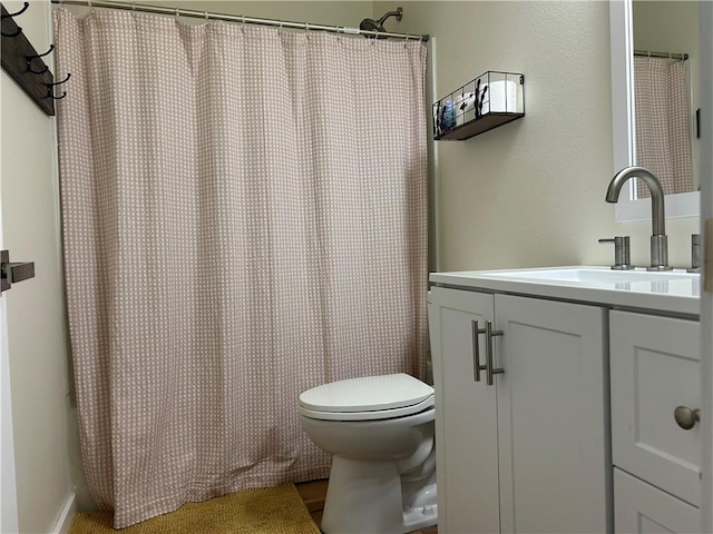 full bath with toilet and vanity