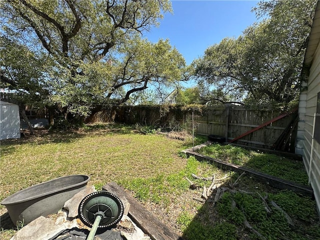 view of yard with a fenced backyard
