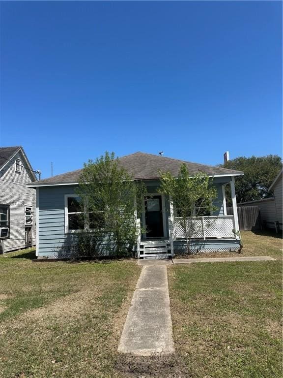 view of front of house with a front lawn and covered porch