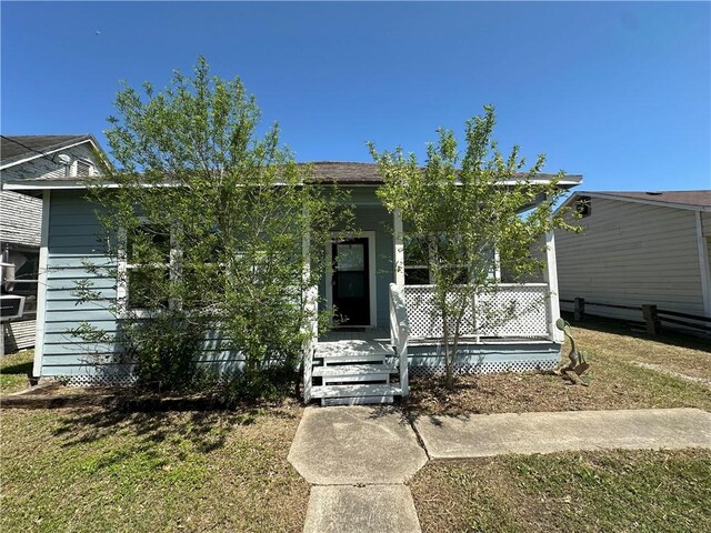 210 Dunbar St, Refugio, TX 78377 - view of front facade featuring covered porch