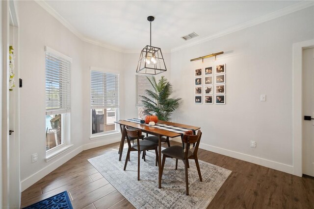 641 Hyacinth Dr, Corpus Christi, TX 78413 - dining room with wood finished floors, baseboards, and crown molding