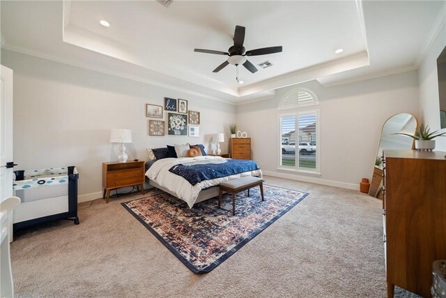 641 Hyacinth Dr, Corpus Christi, TX 78413 - bedroom featuring a tray ceiling, light colored carpet, crown molding, baseboards, and recessed lighting