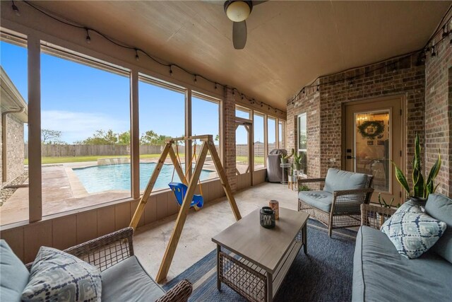641 Hyacinth Dr, Corpus Christi, TX 78413 - sunroom / solarium with brick wall, ceiling fan, and outdoor lounge area