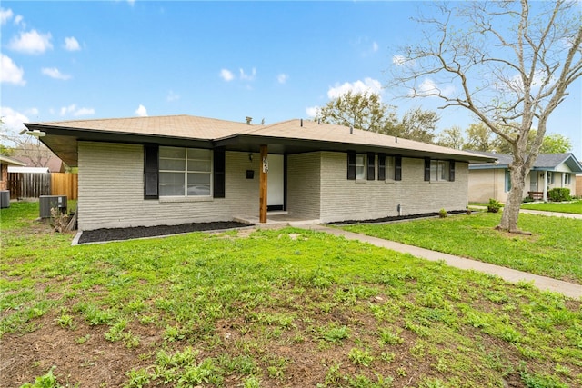 single story home featuring central air condition unit and a front yard