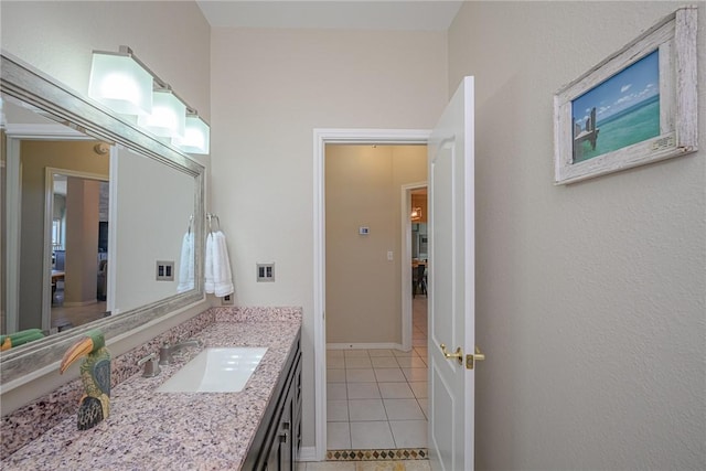 109 Redfish Ct, Aransas Pass, TX 78336 - bathroom with tile patterned floors, vanity, and baseboards