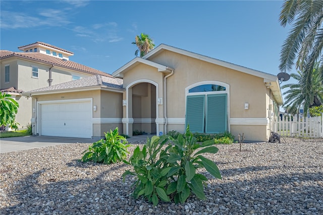 view of front of property with a garage