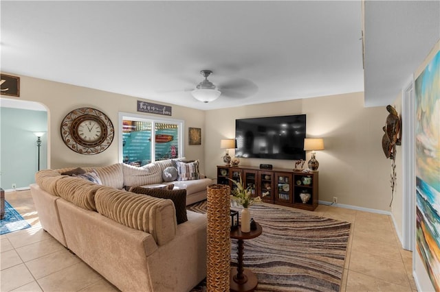 living room with ceiling fan and light tile patterned flooring