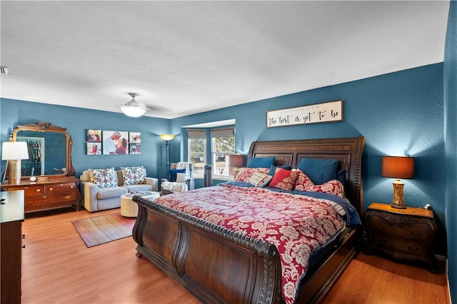 bedroom featuring ceiling fan and wood-type flooring