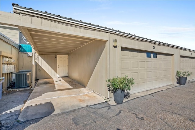 exterior space featuring central AC and a carport