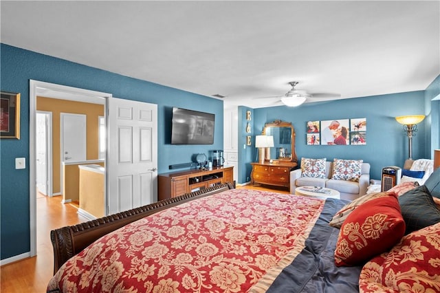 bedroom with ceiling fan and light hardwood / wood-style floors