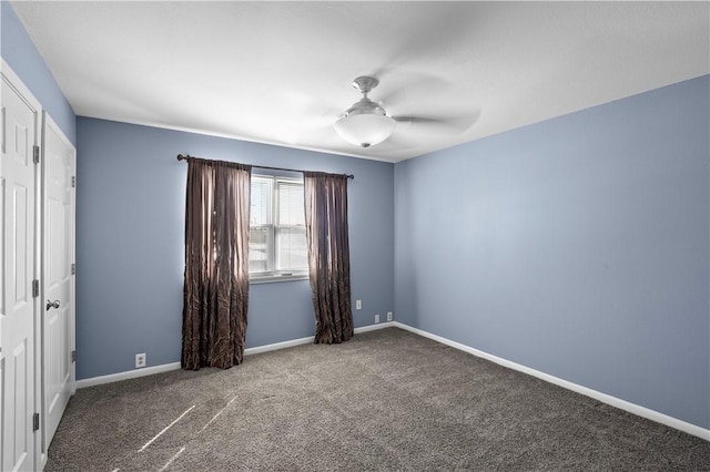 unfurnished room with ceiling fan and carpet floors