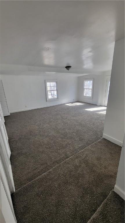 empty room with dark carpet